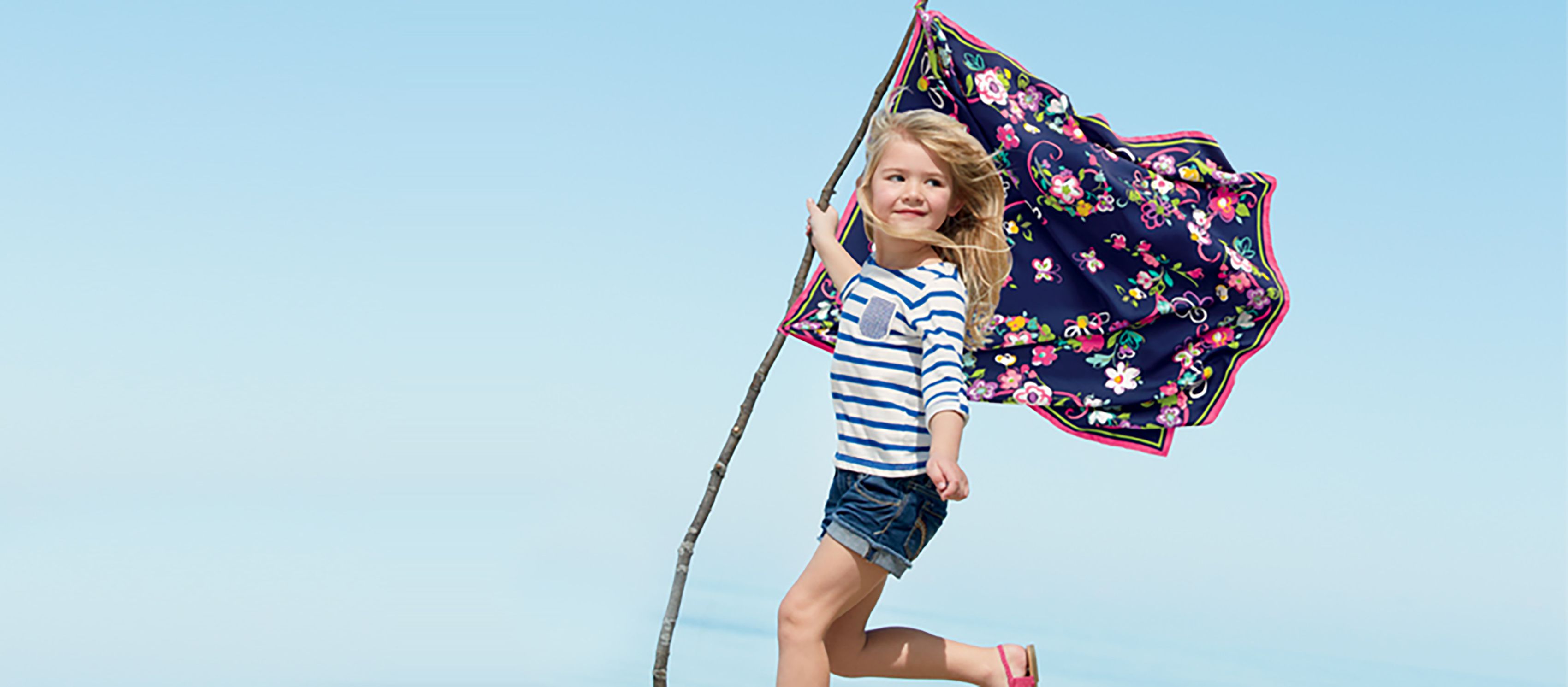 Vera Bradley Girl Holding Floral Flag On Beach